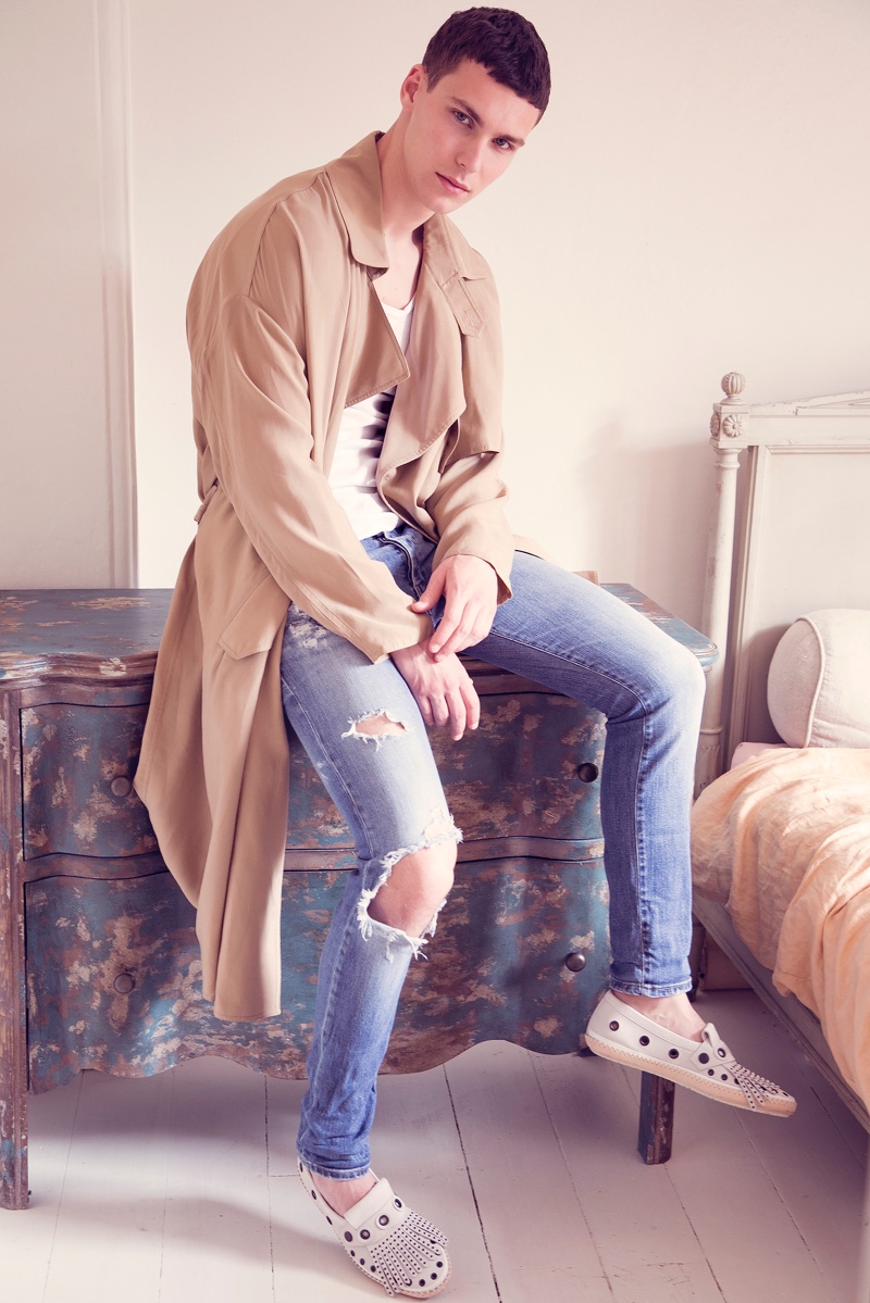 Dima wears coat Giorgio Armani, tank Dolce & Gabbana, custom jeans Levi's, and shoes Bottega Veneta.