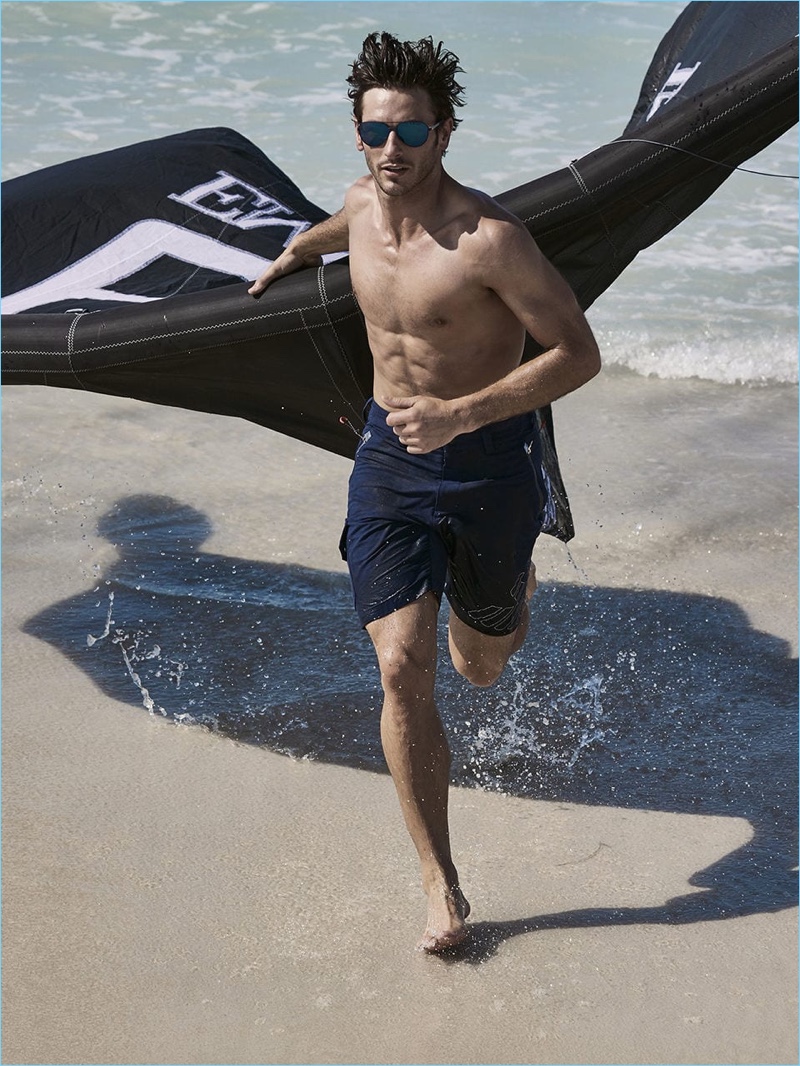Parker Gregory hits the beach for EA7's spring-summer 2018 campaign.