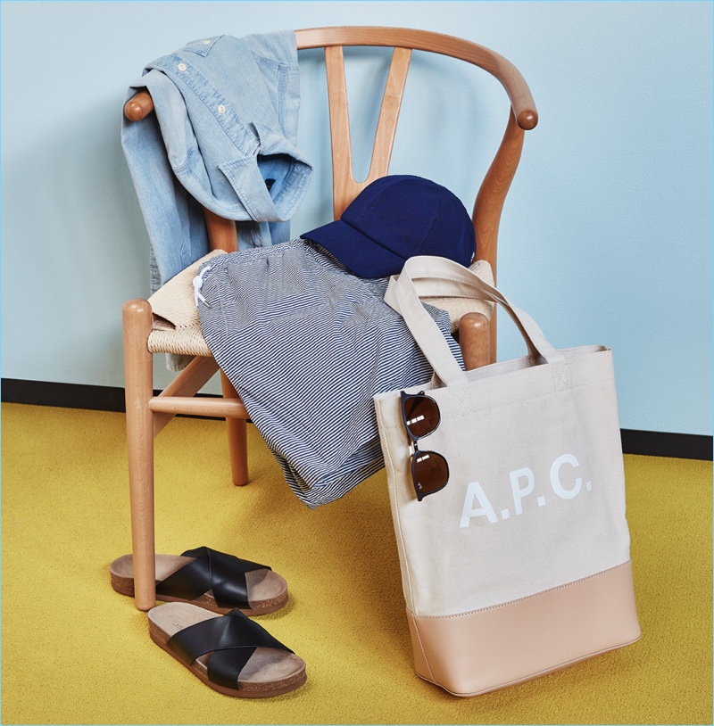 For the Minimalist: Larose seersucker baseball cap, Ray-Ban wayfarer sunglasses, POLO Ralph Lauren chambray workshirt, A.P.C. sandals, Norse Projects swim trunks, and A.P.C. tote bag.