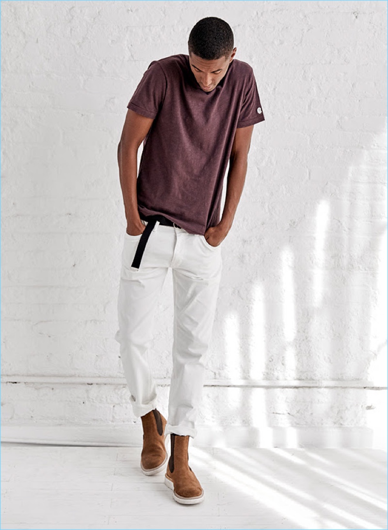 Claudio Monteiro wears a Todd Snyder x Champion t-shirt with the designer's white selvedge jeans. The Portuguese model also dons a Todd Snyder double ring leather belt and Tricker's x Todd Snyder Chelsea boots.