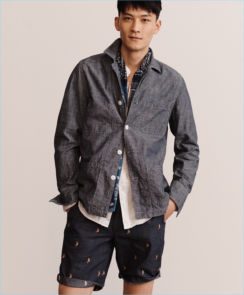 Model InHyuk Yeo is picture-perfect in a Wallace & Barnes chambray shirt jacket with a J.Crew band-collar shirt and chambray shorts.