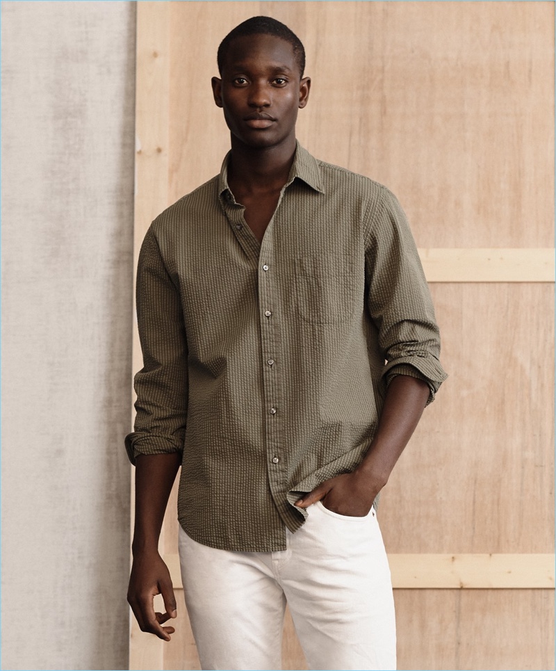 Going casual, Charles Oduro models a J.Crew seersucker shirt with 484 slim stretch white jeans.