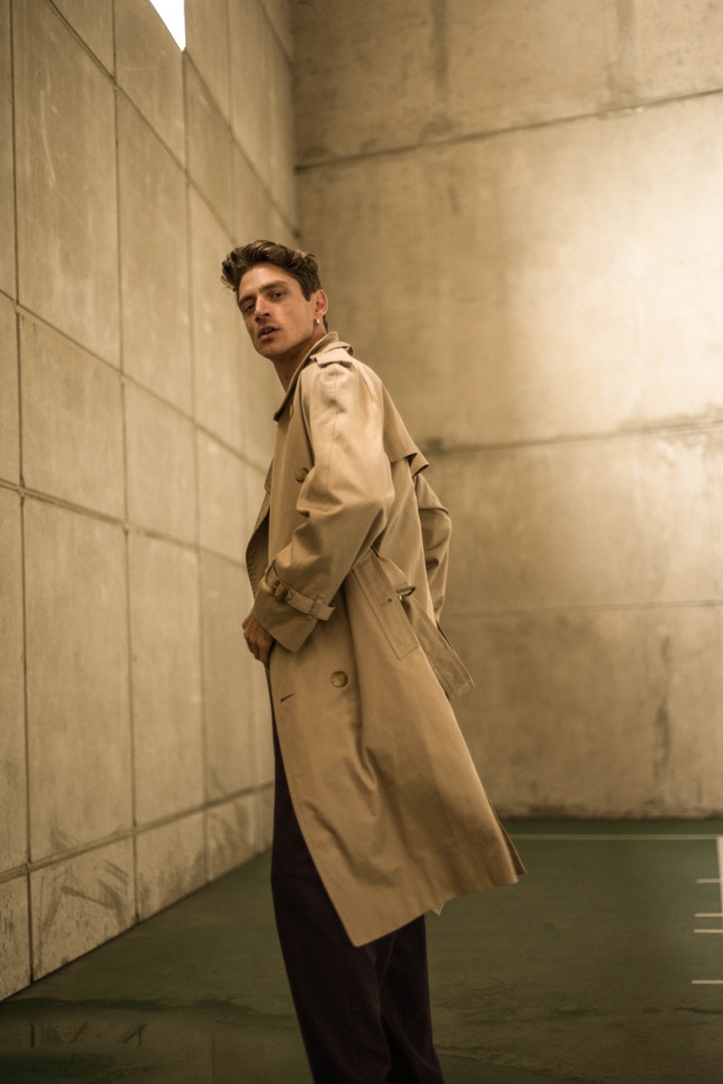 Laurent wears trench coat Burberry and pants Libertine.