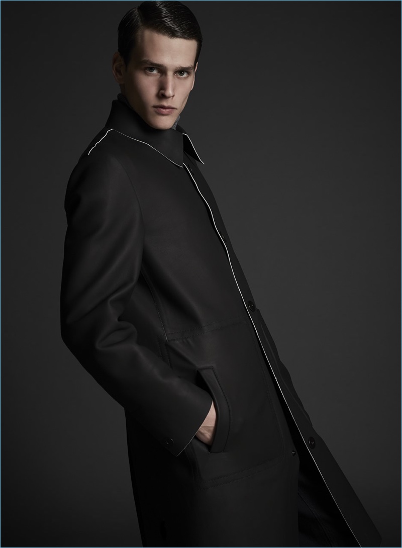 Donning a minimal coat, Simon Van Meervenne is a sleek vision in Major Giovanni Allegri.