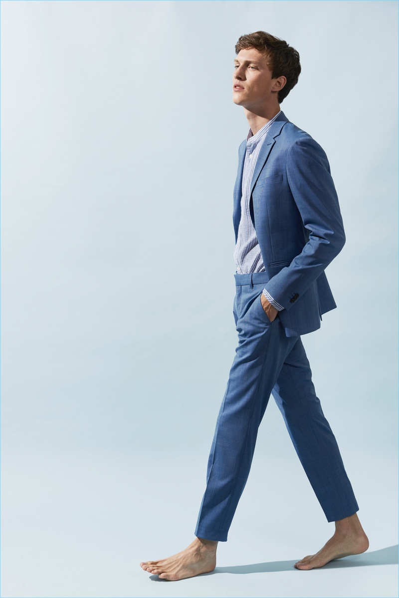 Sporting a sharp blue suit, Malthe Lund Madsen fronts Matinique's summer 2018 campaign.