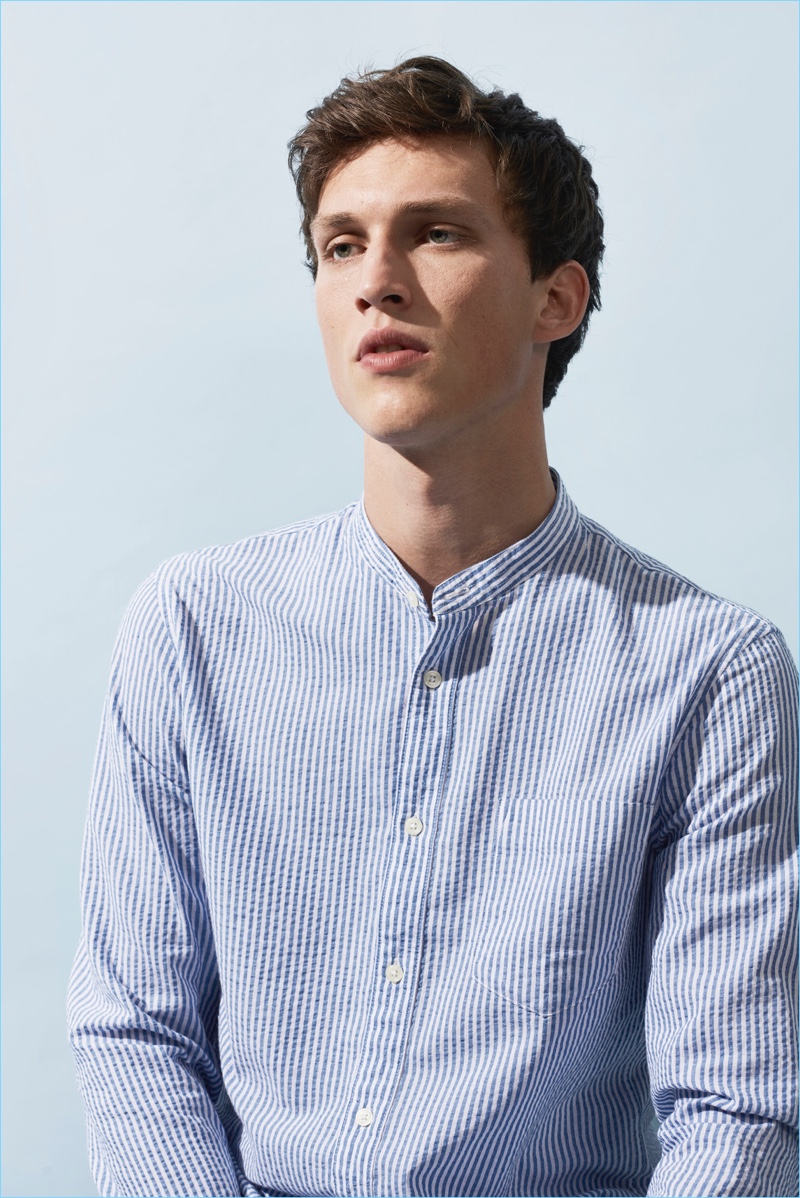 Donning a light blue band-collar shirt, Malthe Lund Madsen appears in Matinique's summer 2018 campaign.