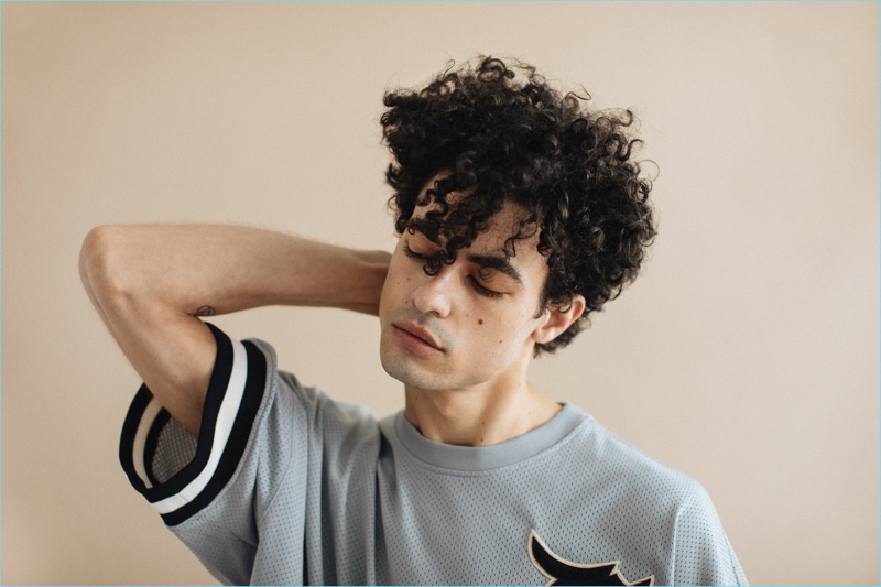 Malik Winslow rocks his natural curls with help from Blind Barber's 40 Proof Sea Salt Spray.