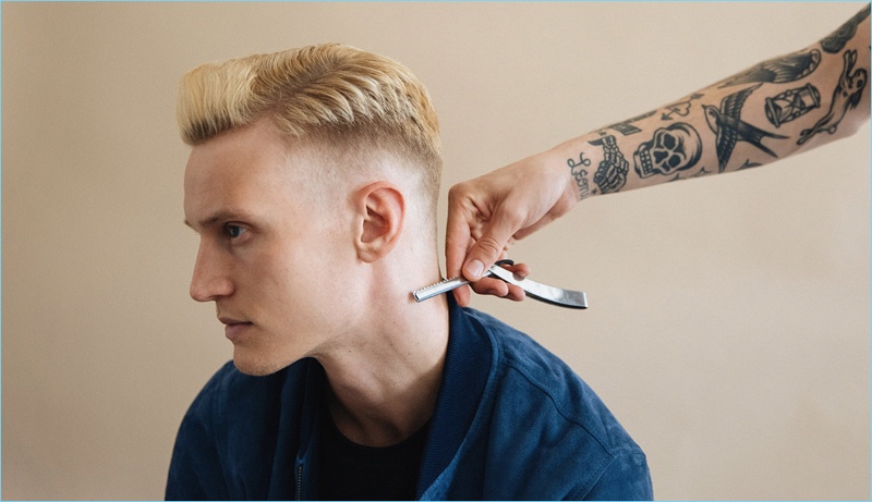 Model Alexander Johansson receives a hair update with a side part faded to skin hairstyle.