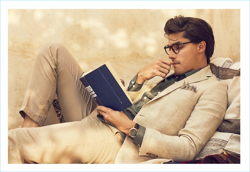 Reading a book, Isaac Weber appears in Morris' spring-summer 2018 campaign.