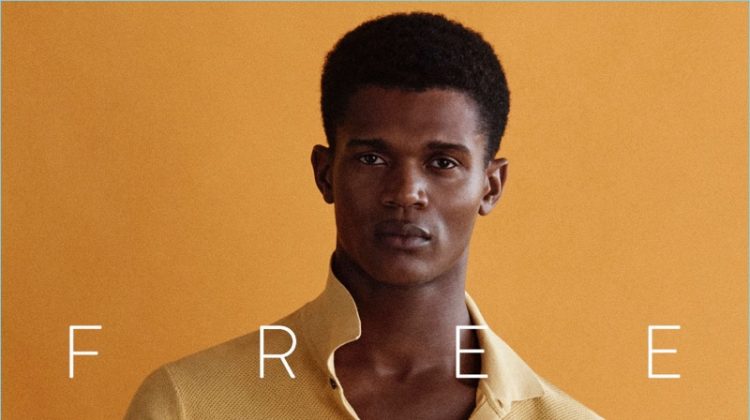 Embracing a pop of color, O'Shea Robertson wears a yellow polo from Massimo Dutti.