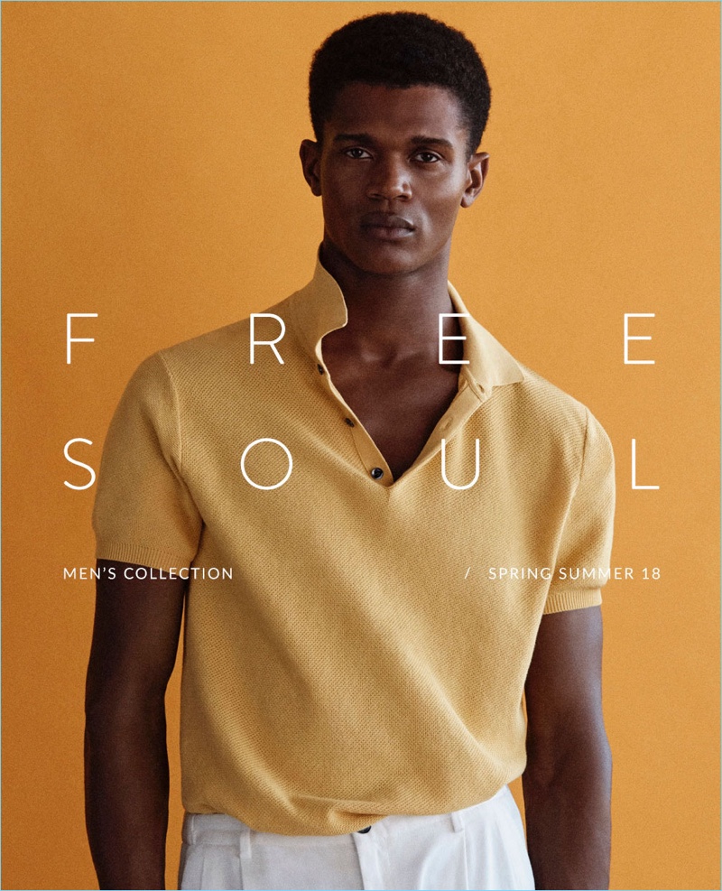 Embracing a pop of color, O'Shea Robertson wears a yellow polo from Massimo Dutti.