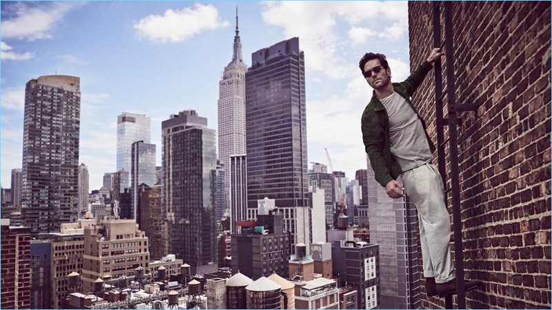 Paul Rudd wears an AMI suede shirt jacket and Oliver Spencer t-shirt. He also sports Mr P. chinos, Officine Creative suede boots and Jacques Marie Mage sunglasses.