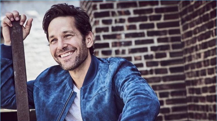 All smiles, Paul Rudd wears a Dunhill suede bomber jacket and Club Monaco t-shirt.