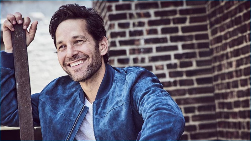 All smiles, Paul Rudd wears a Dunhill suede bomber jacket and Club Monaco t-shirt.