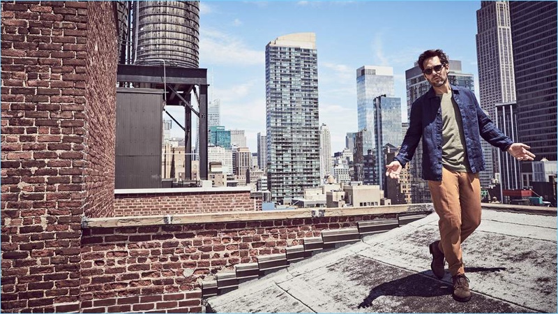 Starring in a new photo shoot, Paul Rudd wears a NN07 shirt jacket, Massimo Alba t-shirt, Sandro cropped trousers, and Officine Creative suede boots.