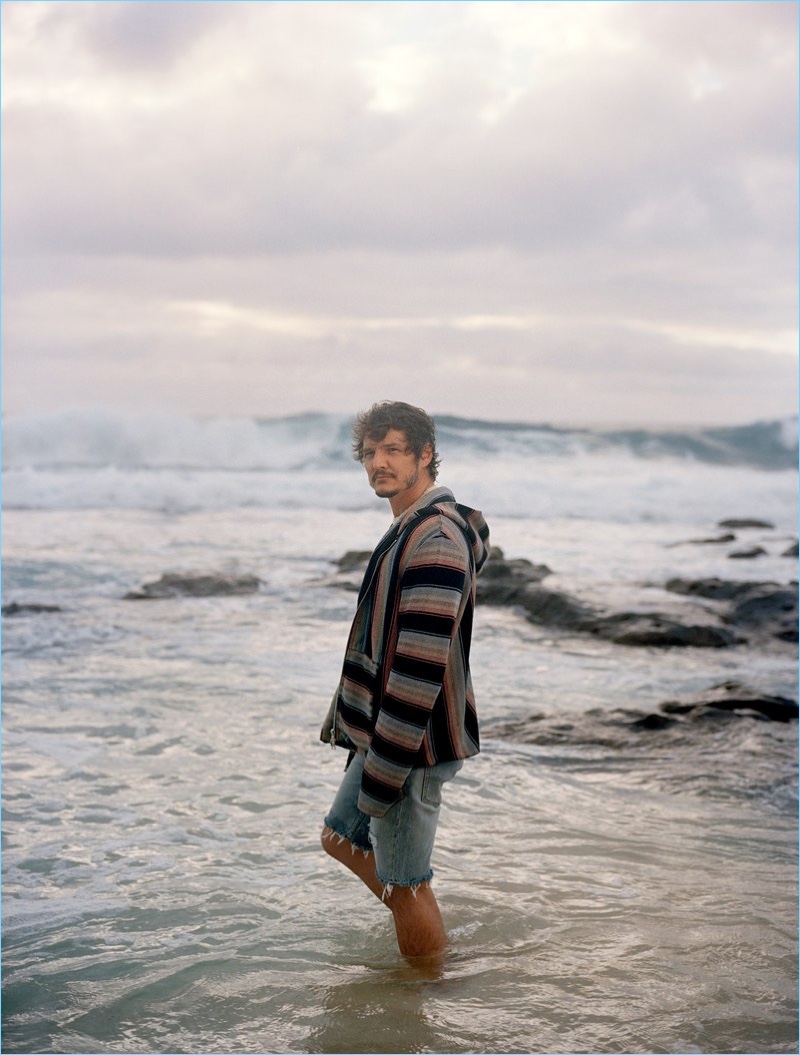 Taking to the beach, Pedro Pascal wears an Amiri sweater with Levi's Vintage Clothing shorts.