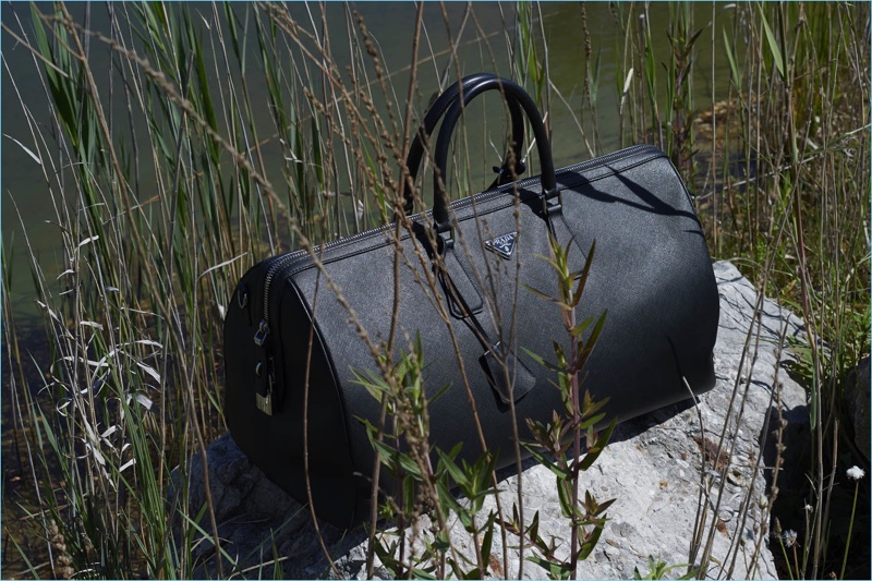 Prada highlights its Saffiano leather travel bag.