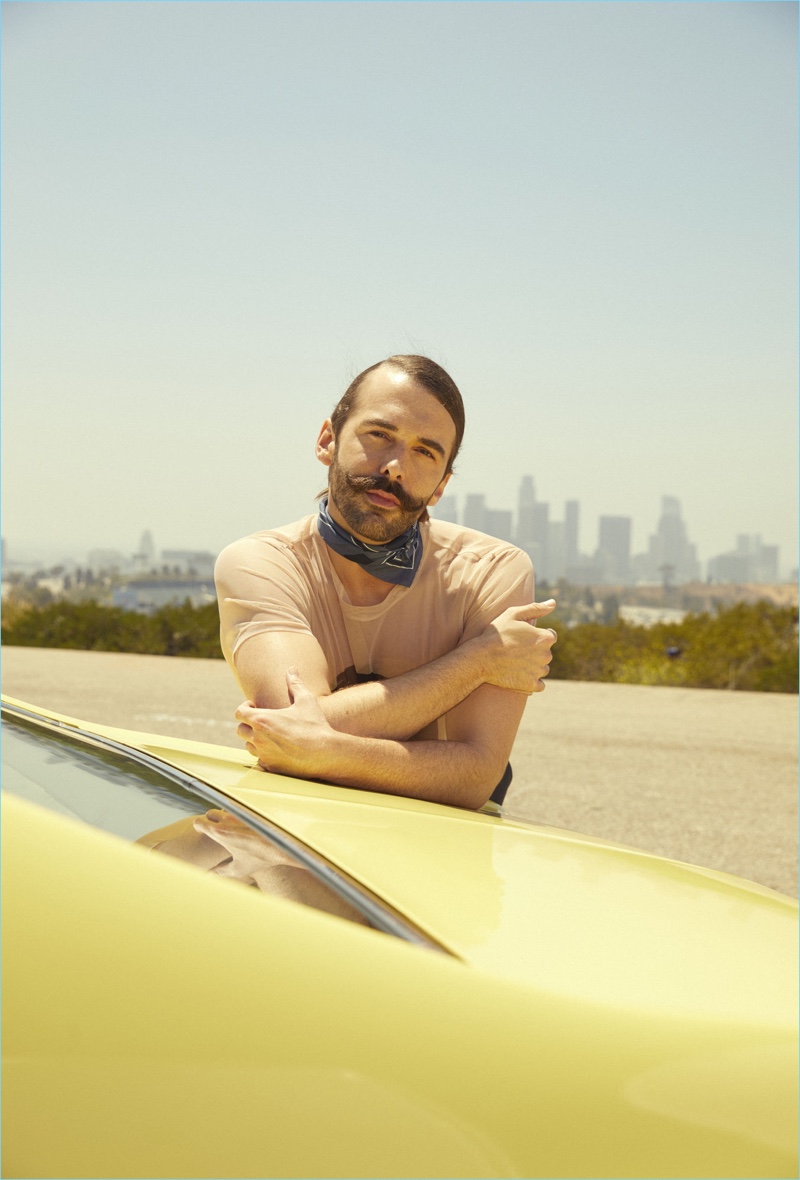 Jonathan Van Ness wears a mesh HUGO t-shirt and BOSS scarf.