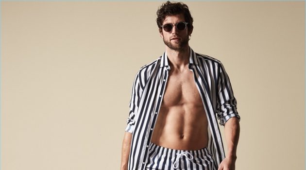 Summer Up in Soft Hued Swimwear from Reiss Making a striped statement, Jan Trojan wears Reiss' Flint stripe swim shorts in navy.