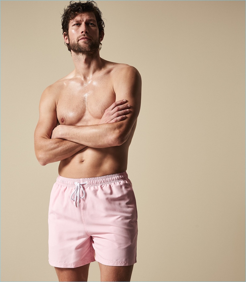 Reuniting with Reiss, Jan Trojan wears the brand's Sonar swim shorts in soft pink.
