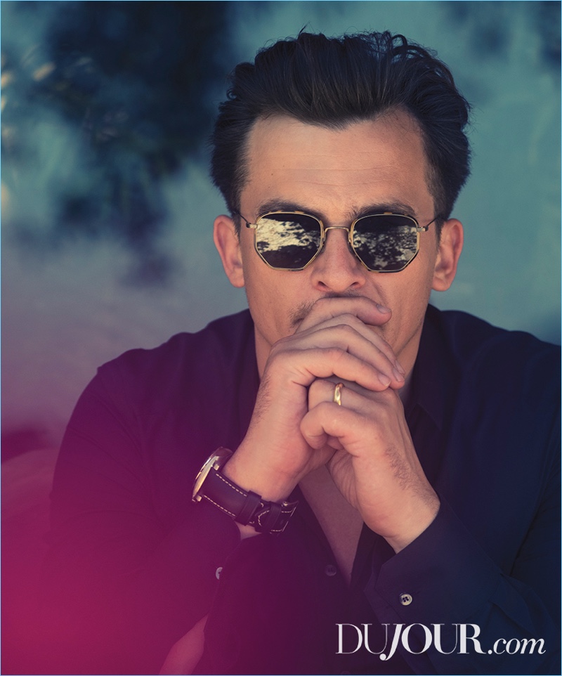 Ready for his close-up, Rupert Friend wears a Dolce & Gabbana shirt, Panerai watch, and Oliver Peoples sunglasses.