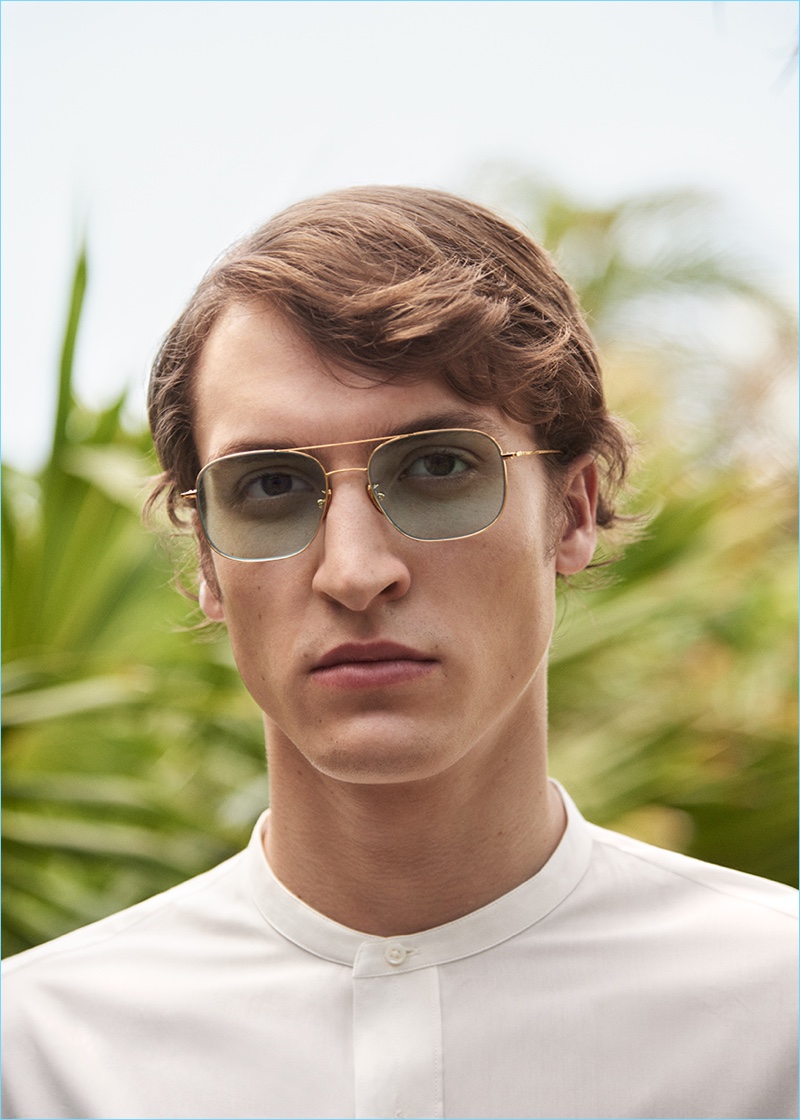 Model Tim Dibble dons Cutler and Gross sunglasses with an Officine Generale shirt.