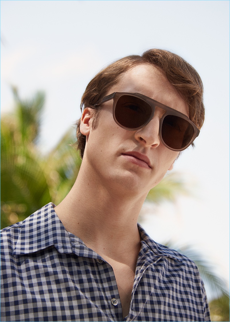 Soaking in the summer sun, Tim Dibble wears Andy Wolf sunglasses with a Barena Venezia shirt.