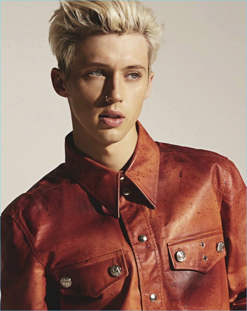 Singer Troye Sivan dons a leather jacket by Calvin Klein.