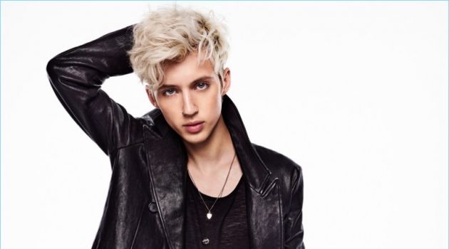 Troye Sivan Connects with GQ, Talks Meaning of 'Bloom' Clad in an Alexander McQueen leather coat, Troye Sivan also wears a Saint Laurent tank and Topman jeans.