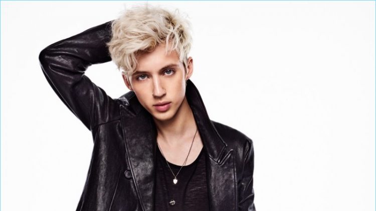 Clad in an Alexander McQueen leather coat, Troye Sivan also wears a Saint Laurent tank and Topman jeans.