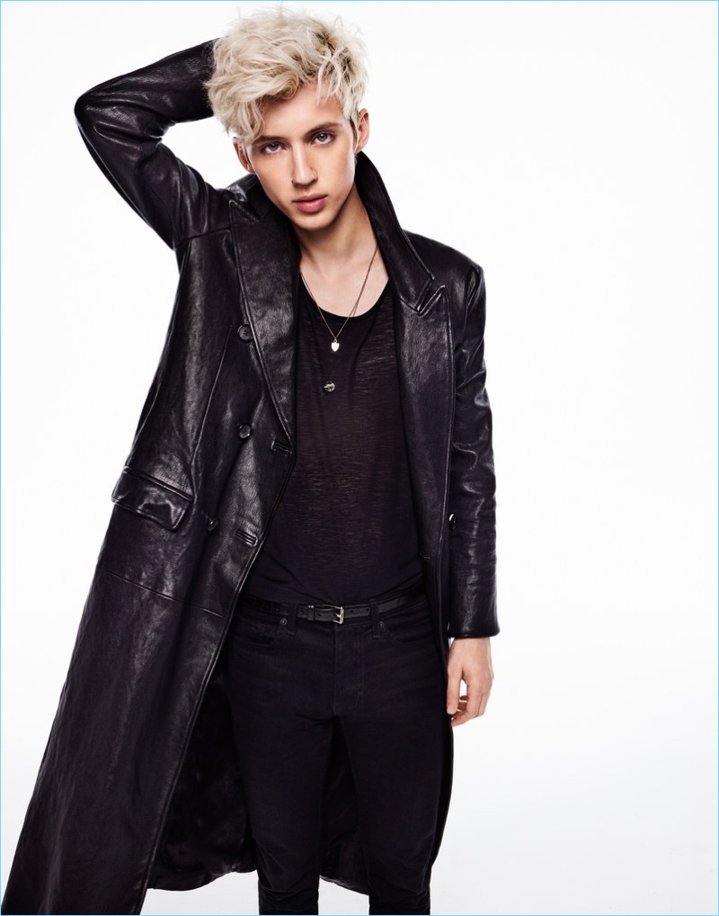 Clad in an Alexander McQueen leather coat, Troye Sivan also wears a Saint Laurent tank and Topman jeans.