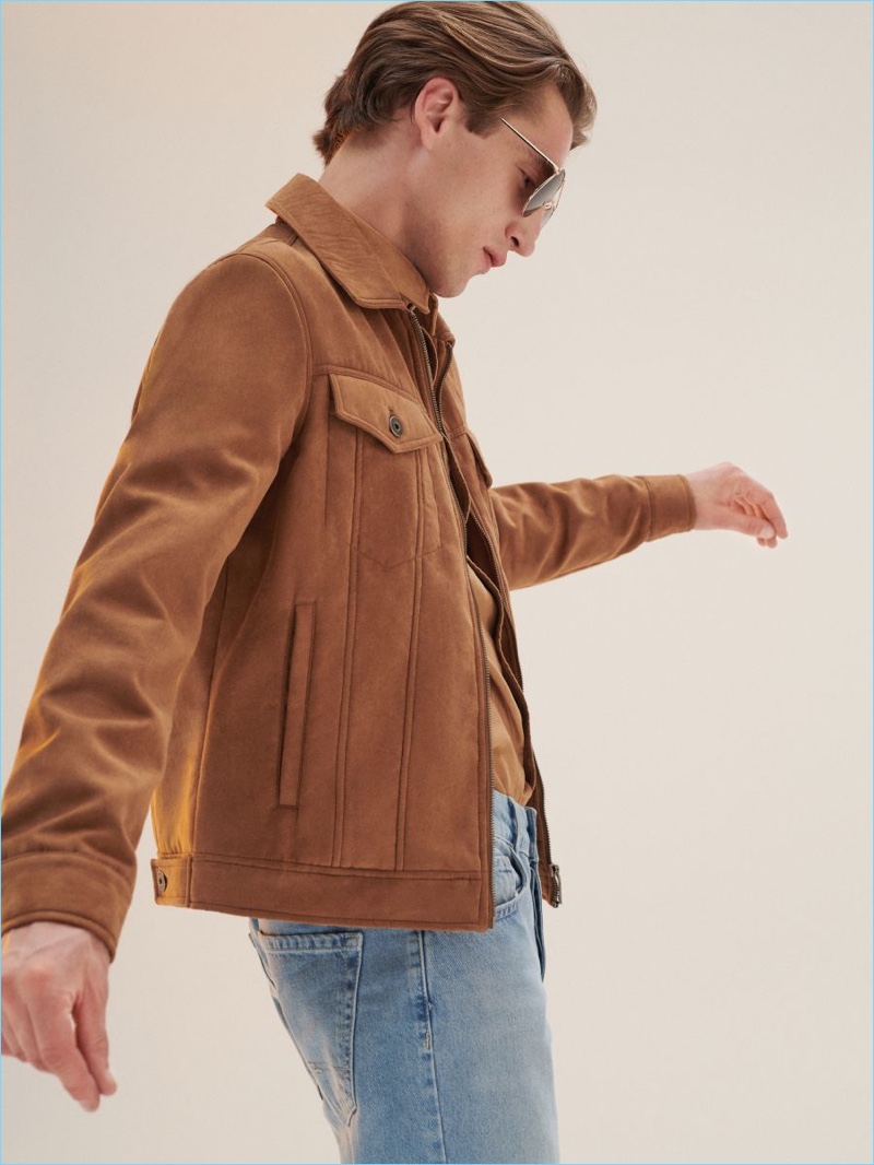 Donning a suede jacket, Anatol Modzelewski models a look from Reserved.