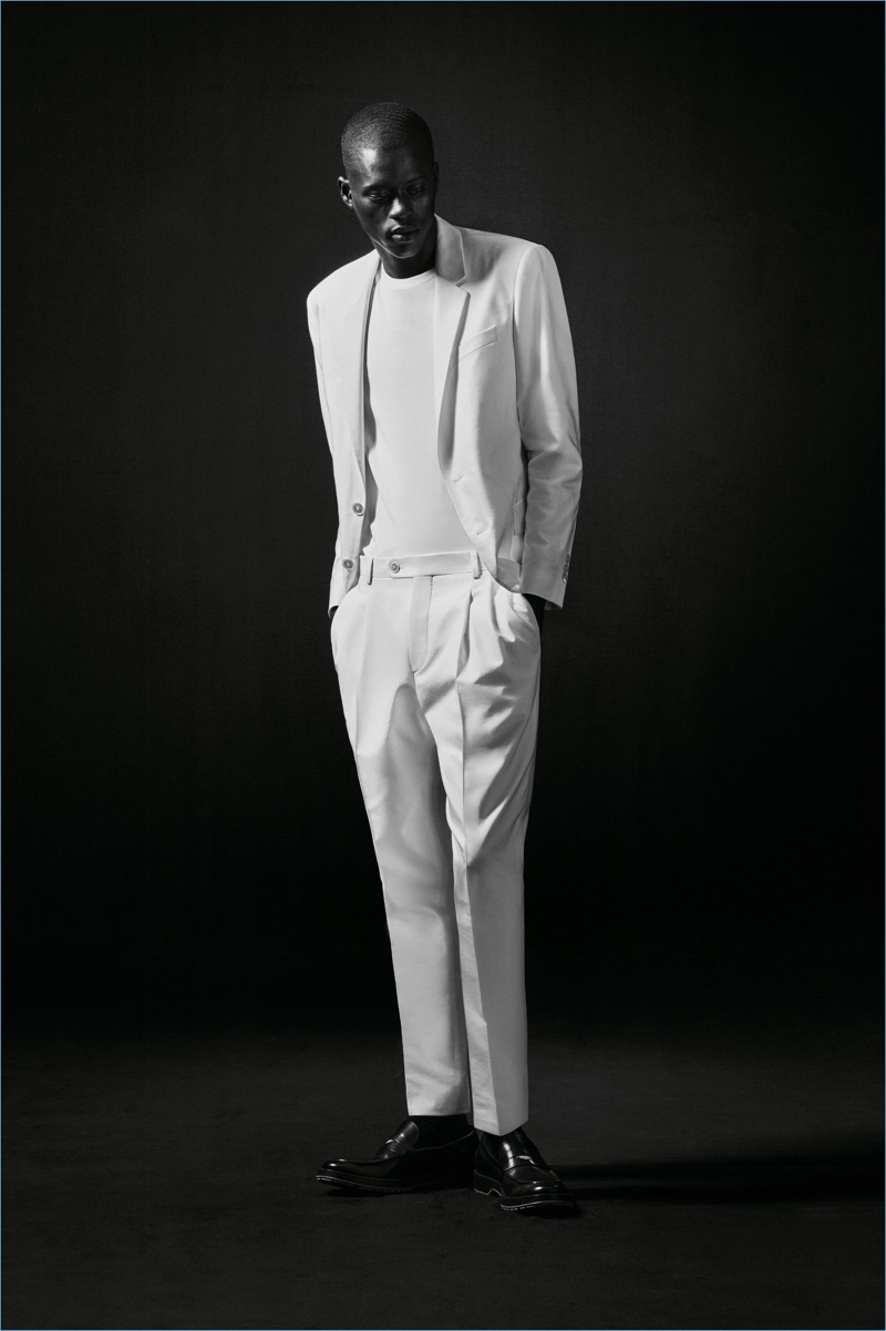 Model Alpha Dia sports a sharp white suit from the BOSS x Michael Jackson capsule collection.