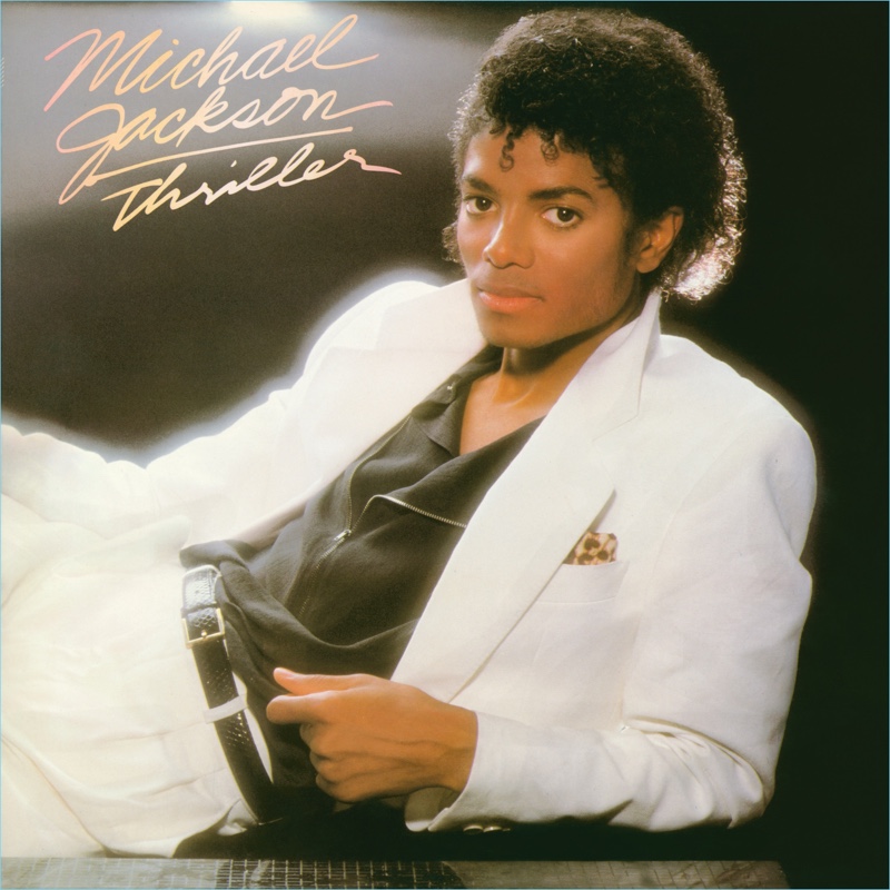 Michael Jackson wears a white suit for his iconic Thriller album artwork.