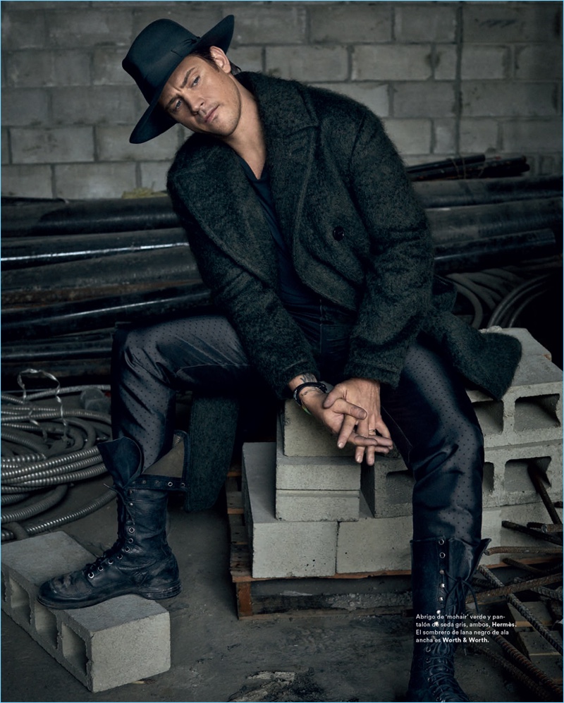 Appearing in a new photo shoot, Boyd Holbrook dons a mohair coat and pants from Hermès. He also sports a Worth & Worth hat.