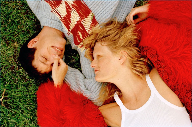 Embracing sweater weather, John Swiatek poses with his wife Hanne Gaby Odiele. John sports a Calvin Klein 305W39NYC sweater.