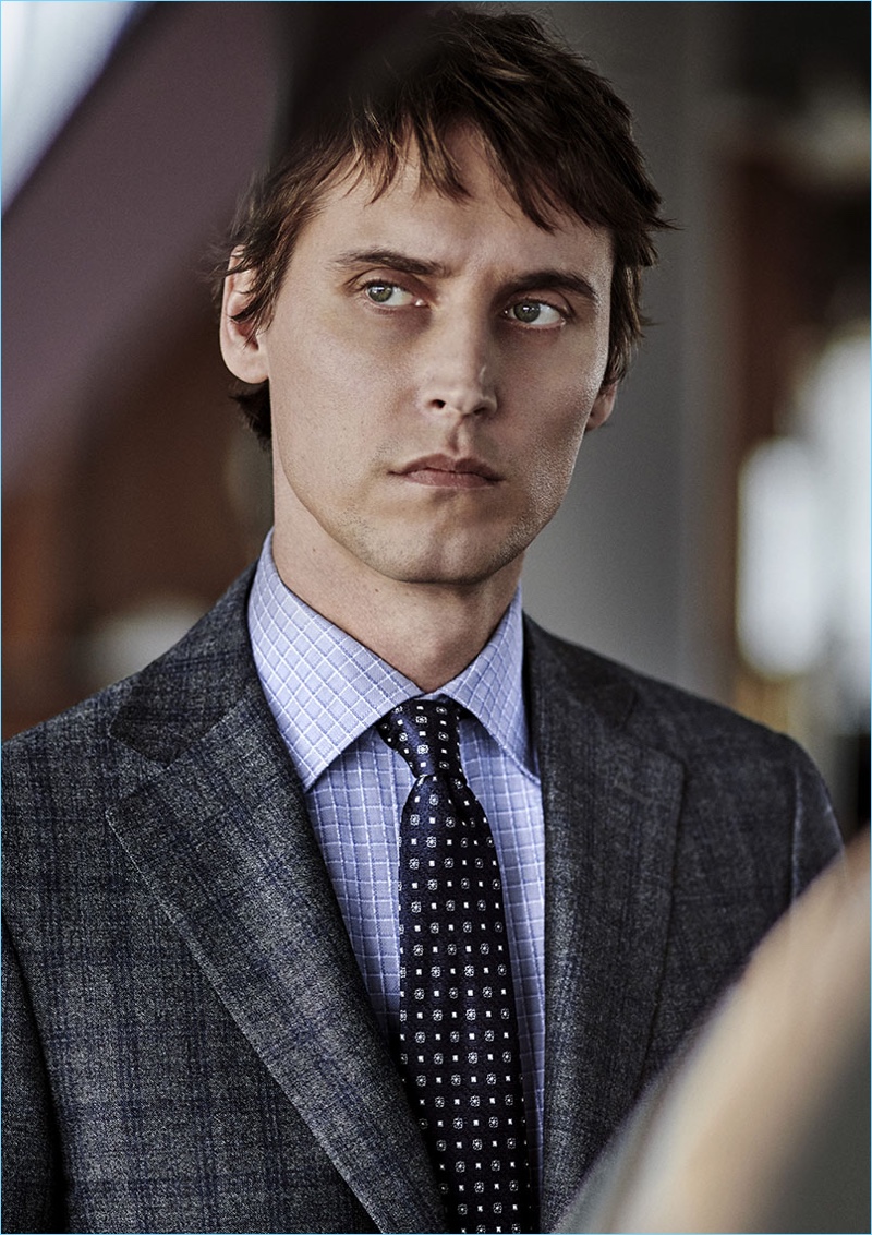 French model Sébastien Andrieu wears a sharp suit, shirt, and tie by Canali.