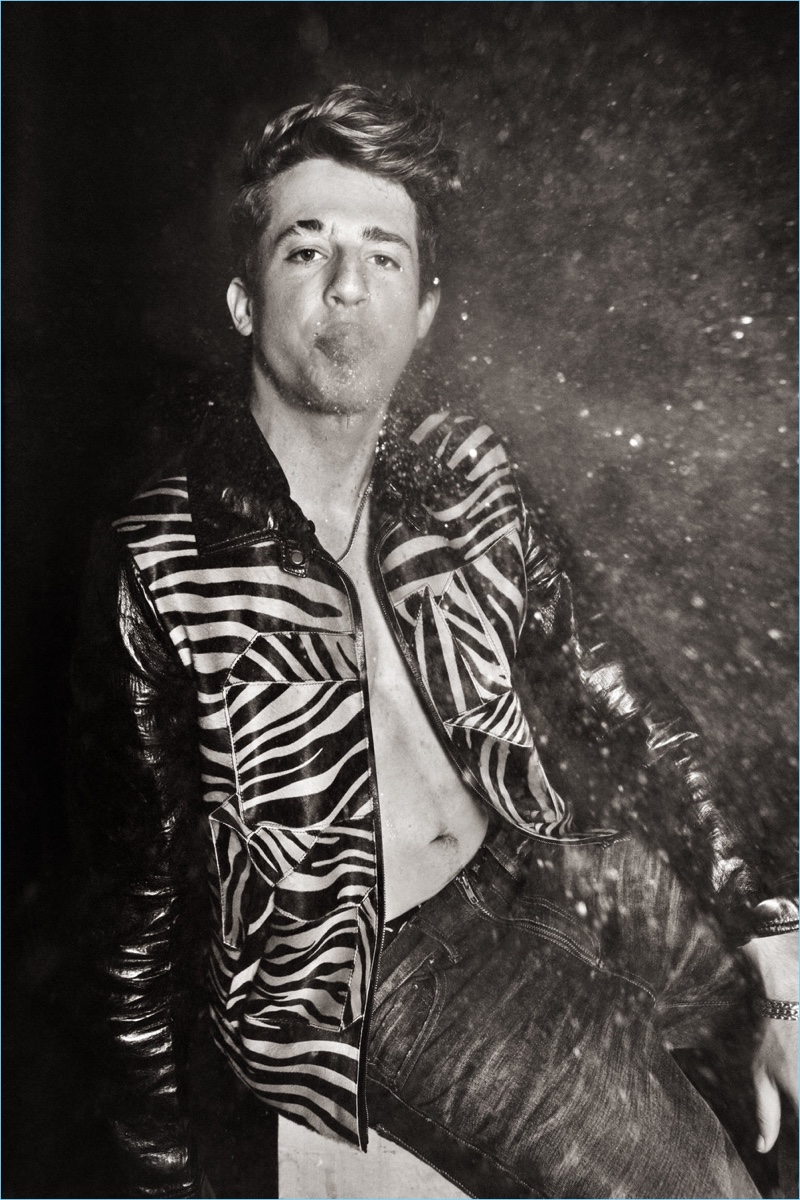 Starring in a photo shoot, Charlie Puth sports a Frame Denim shirt and Bottega Veneta jacket. 