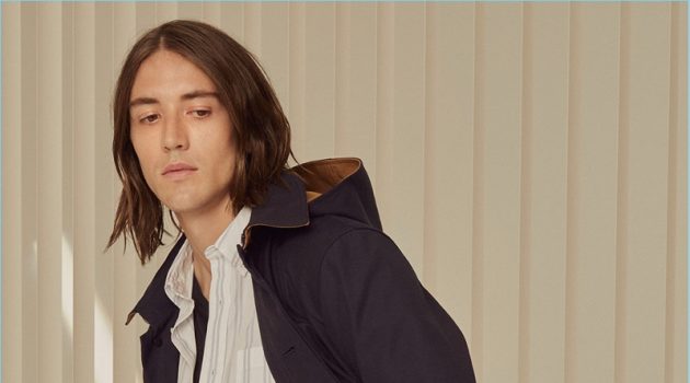 Day Shift: Lucian Clifforth Transitions Into Fall with Club Monaco Showcasing everyday style, Lucian Clifforth wears a Club Monaco v-neck, striped shirt, super slim denim jeans, and a coat.