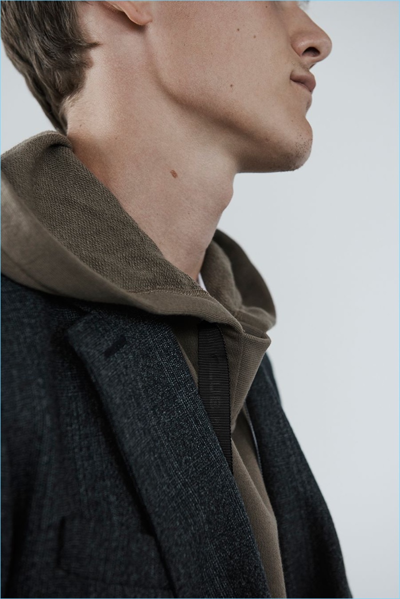 Bringing texture to the season, Ryan Keating wears a hoodie and double-breasted blazer from Club Monaco.