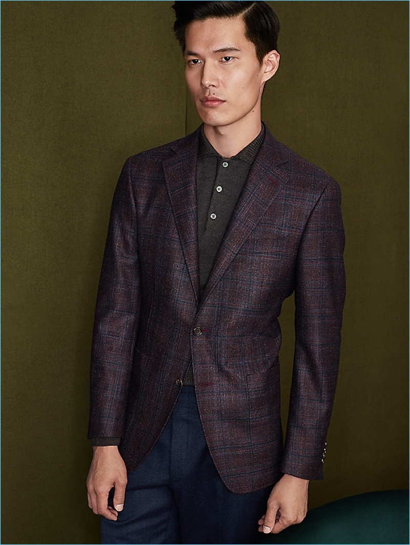 Connecting with Holt Renfrew, Dae Na wears a Canali blazer and pants.
