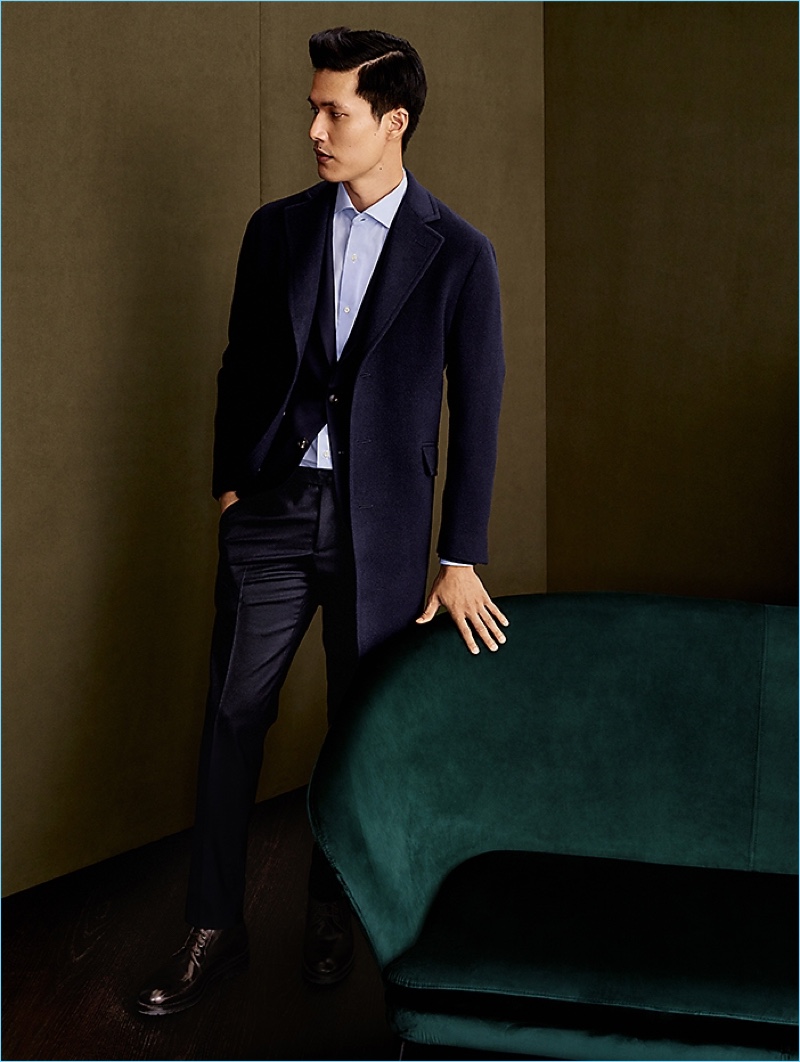 A sleek vision, Dae Na dons a Boglioli top coat, suit, and shirt.