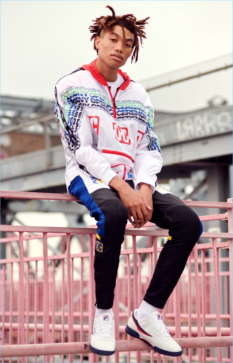 Going graphic, Seth Hill wears a Opening Ceremony anorak jacket with a Fila tee and sneakers. He also sports Opening Ceremony's moto pants.