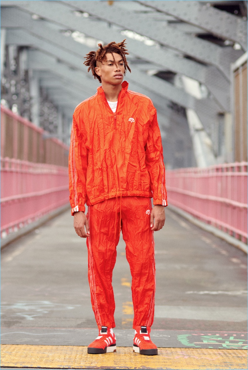 Embracing monochromatic style, Seth Hill wears a Sunspel tee with a windbreaker, pants, and sneakers from Adidas Originals by Alexander Wang.