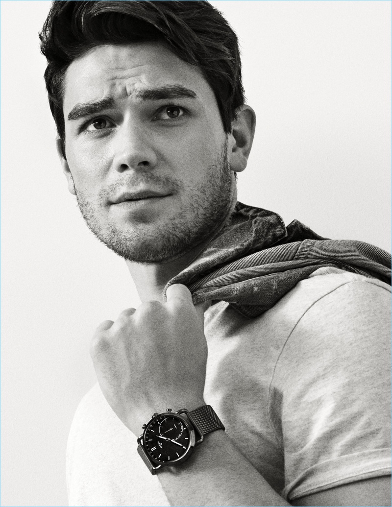 Actor KJ Apa dons the Fossil Hybrid Smartwatch Q Commuter in stainless steel.