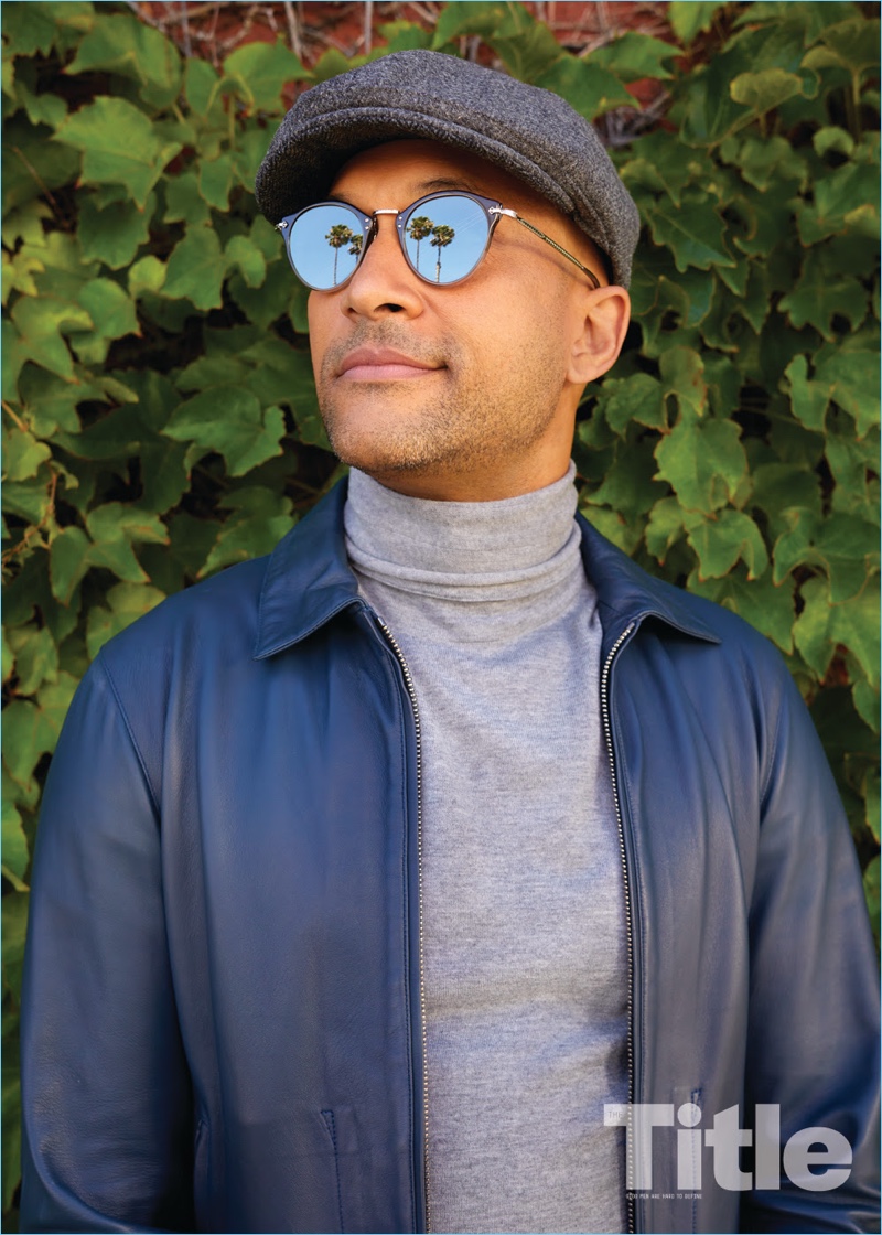 Starring in a photo shoot, Keegan-Michael Key sports an Eidos Napoli jacket, COS turtleneck, Garrett Leight sunglasses, and a Goorin Bros. hat.
