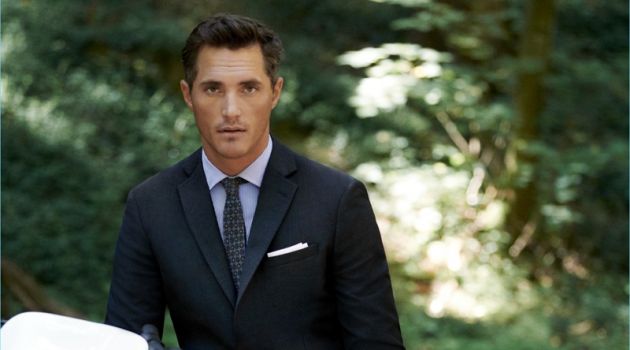 Ollie Edwards Takes Mango's Travel Suit for a Ride British model Ollie Edwards wears Mango Man's travel suit in navy check.