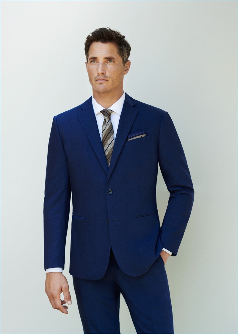 Front and center, Ollie Edwards sports Mango Man's travel suit in Prussian blue.