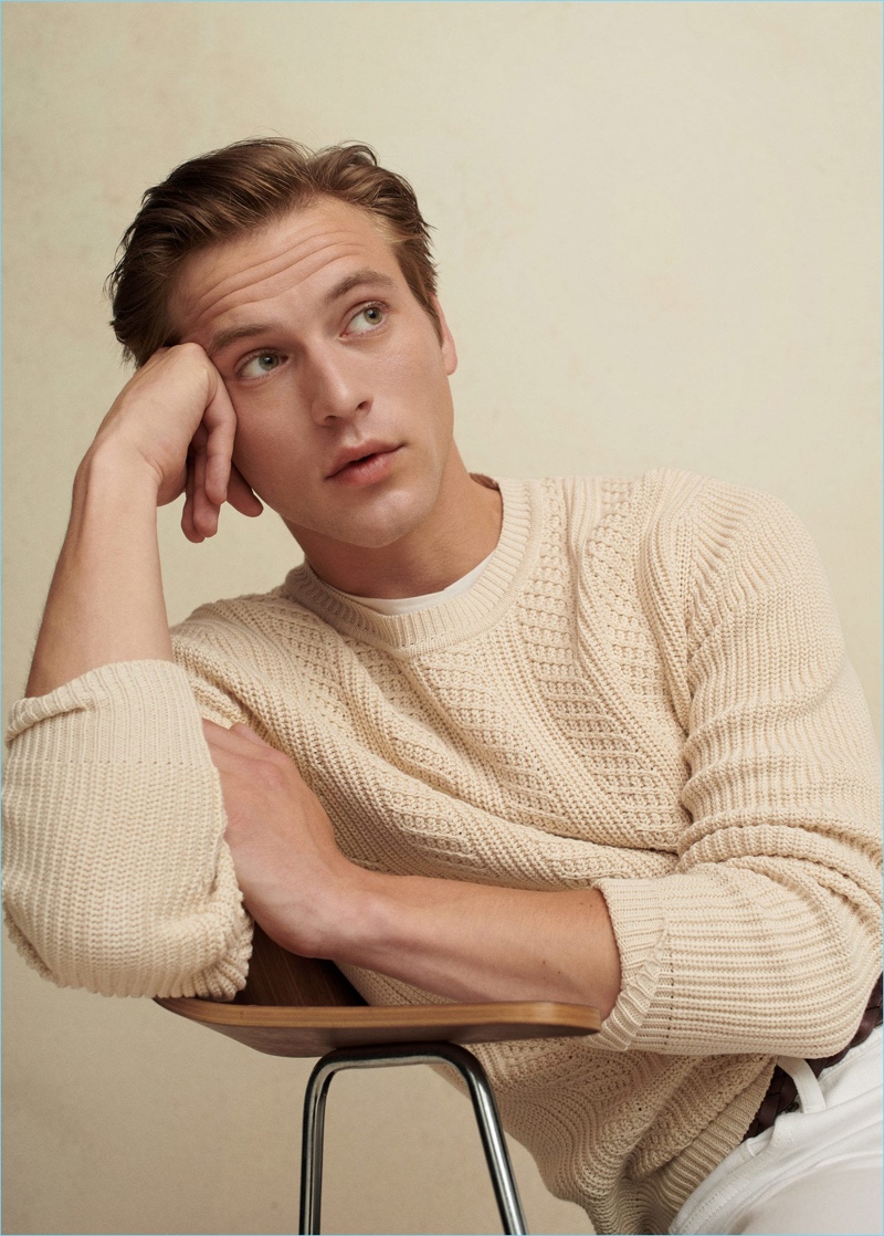 Jules Raynal wears a cable-knit sweater from Mango Man.