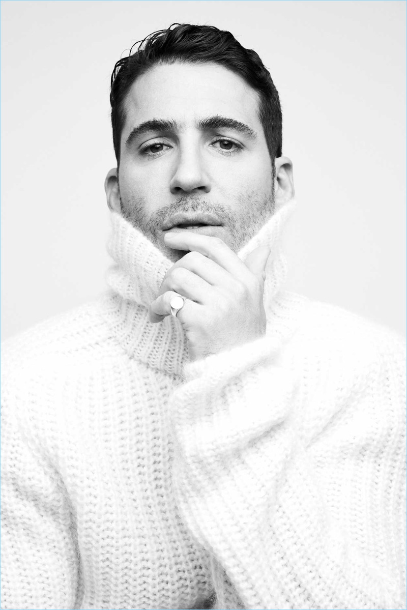 A chic vision, Miguel Angel Silvestre wears a BOSS turtleneck sweater.